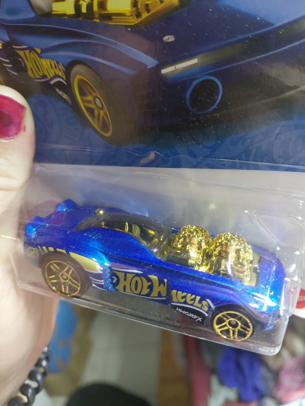 the Hot Wheels Rodger Dodger 2.0 from the 2026 58th Anniversary Blue and Gold se